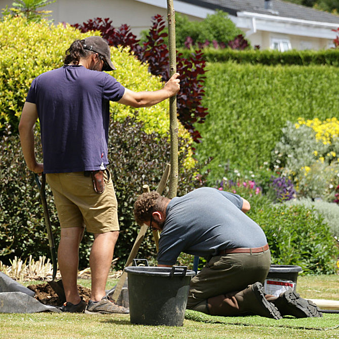 Portraits of our Garden Team. Ollie and Alfie putting the finishing touches to a planted tree in honour of Queen Elizabeth II